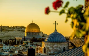 Dome of the Rock with Christian church in foreground in Jerusalem. Shutterstock