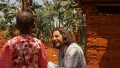 Catholic actor Jonathan Roumie visits Emelyne, a little girl he has sponsored since 2023, in Rwanda.