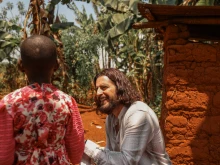 Catholic actor Jonathan Roumie visits Emelyne, a little girl he has sponsored since 2023, in Rwanda.