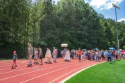 Pilgrims on the Juan Diego route of the National Eucharistic Pilgrimage process on a track in Georgia.