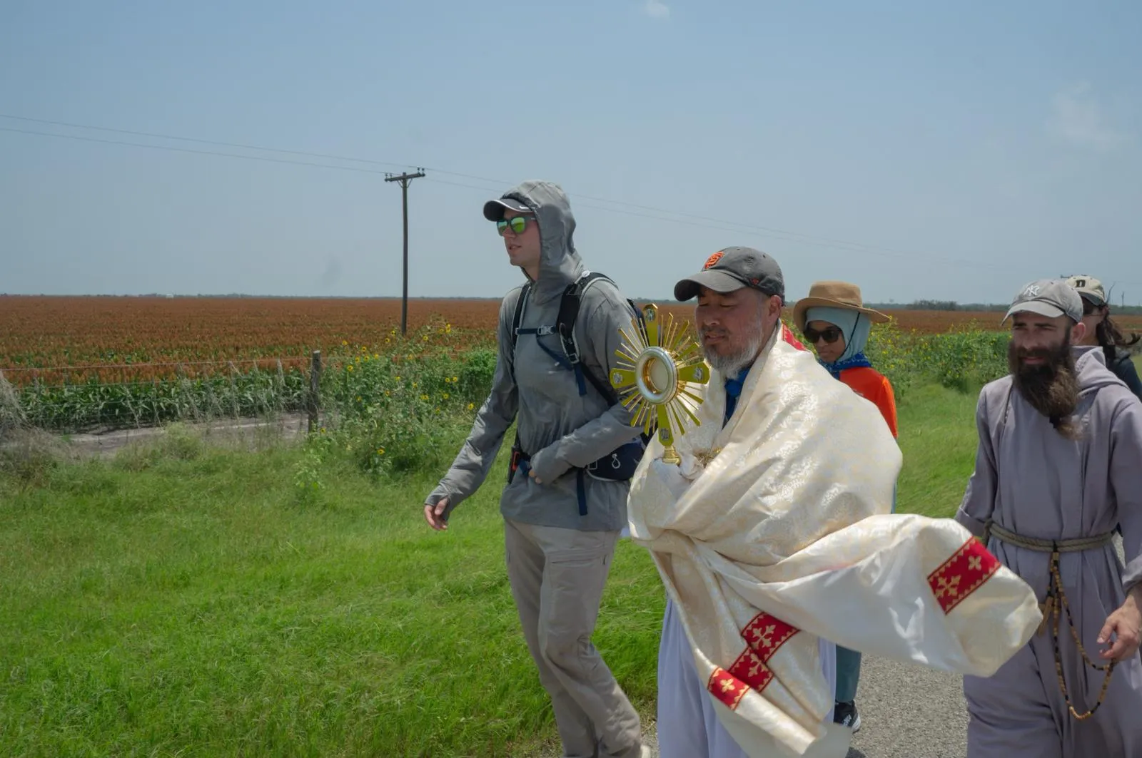 Charlie McCullough, in grey hoodie, walks with the Eucharistic procession through southern Texas.?w=200&h=150