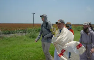 Charlie McCullough, in grey hoodie, walks with the Eucharistic procession through southern Texas. Credit: Issy Martin-Dye