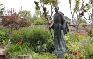 Photograph of a bronze statue of Saint Father Junipero Serra in the Gardens of the Carmel Mission Basilica in Carmel, California Terry Huntingdon Tydings/Shutterstock