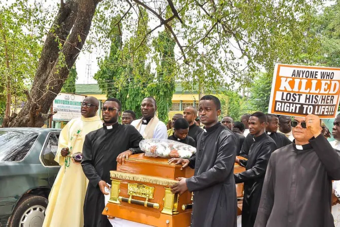 Priests protest at the funeral of Father Vitus Borogo in the archdiocese of Kaduna on June 30, 2022.