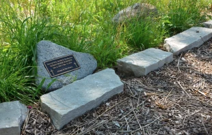 A grave marker in the Meadows of St. Kateri, the natural burial section at St. Michael the Archangel Cemetery in the Archdiocese of Chicago Credit: Archdiocese of Chicago