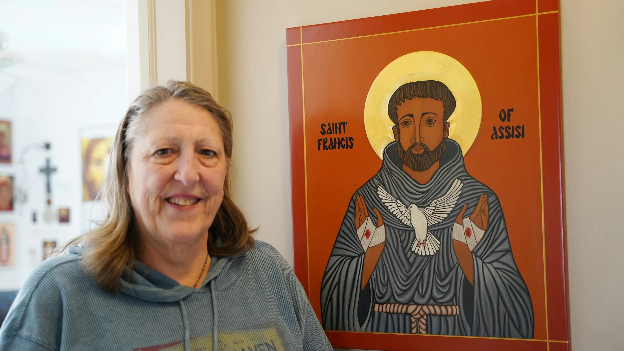 Kathleen Bordo Crombie stands next to an icon of St. Francis of Assisi, dedicated to her late husband, Robyn. The Church of the Divine Child in Dearborn, Michigan, parishioner took up iconography after taking a class at the Sacred Art Institute of St. Edmund’s Retreat Center on Enders Island in Mystic, Connecticut, where she learned iconography is rooted in depicting the image of God.?w=200&h=150