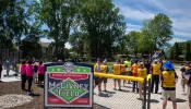 Knights from several councils in Michigan join athletes from the Challenger Division of Clinton Valley Little League, which serves people with disabilities, for the June 15, 2024, dedication of McGivney Field, a new accessible baseball diamond at Neil Reid Park in Clinton Township.