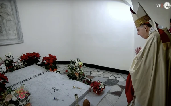 Cardinal Kurt Koch prays at the tomb of Pope Benedict XVI on the second anniversary of the pontiff's death, Dec. 31, 2024. Credit: EWTN