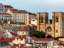 Lisbon cityscape with typical houses and Lisbon Cathedral (Sé de Lisboa).