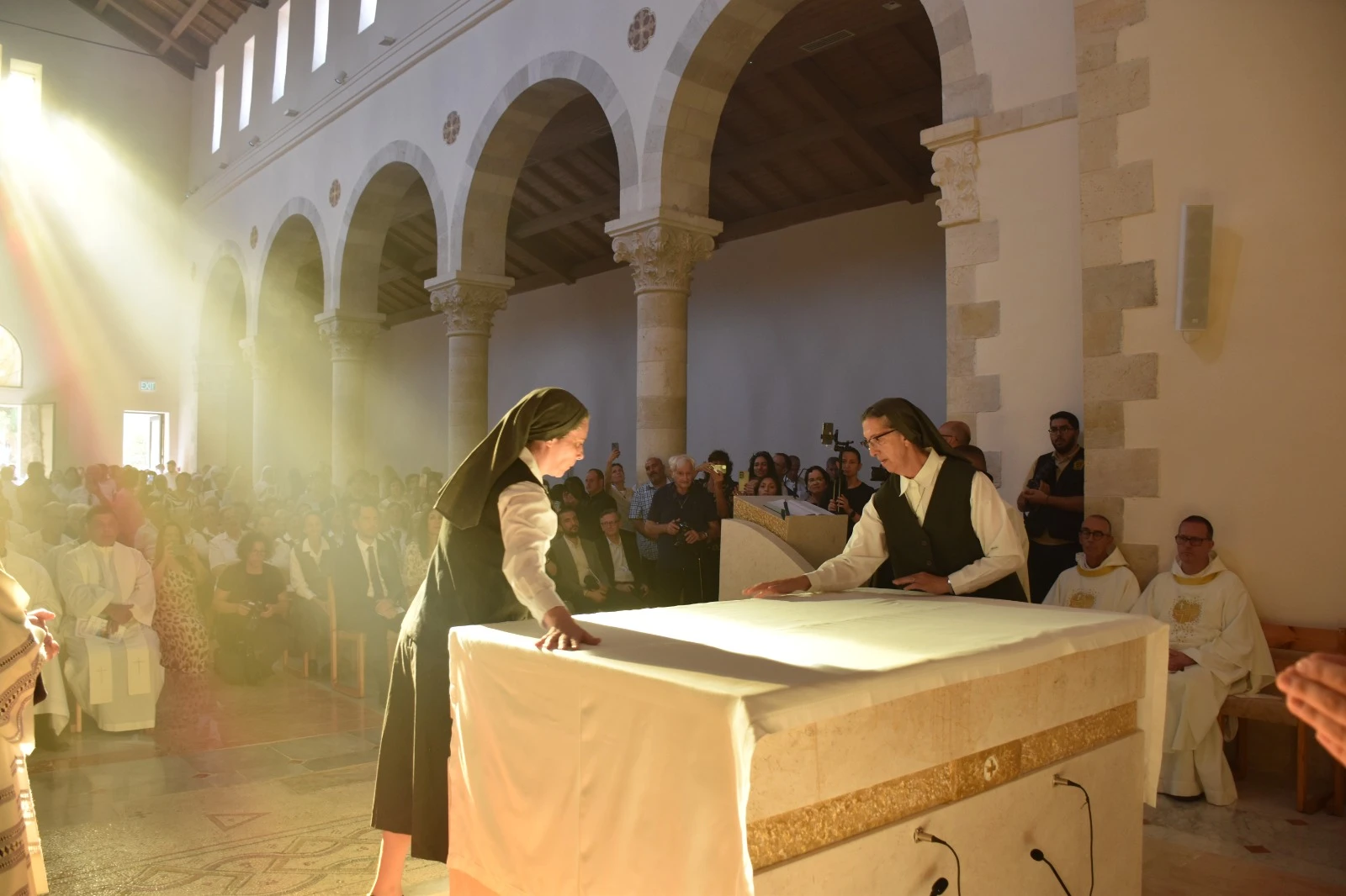 The Sisters of St. Joseph of the Apparition cover the altar, just dedicated by the cardinal. The covering of the altar signifies that it is both the place of the Eucharistic sacrifice and the Lord’s table.?w=200&h=150