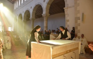 The Sisters of St. Joseph of the Apparition cover the altar, just dedicated by the cardinal. The covering of the altar signifies that it is both the place of the Eucharistic sacrifice and the Lord’s table. Credit: Photo courtesy of the Latin Patriarchate of Jerusalem