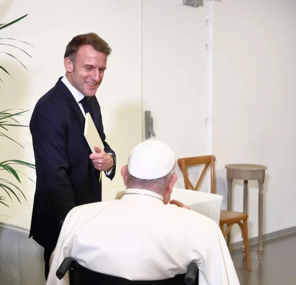 French President Emmanuel Macron exchanges gifts with Pope Francis during a papal visit to Corsica on Dec. 15, 2024. Credit: Daniel Ibáñez/EWTN/Vatican Pool