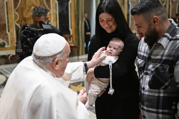 Pope Francis blesses a baby during a meeting with the Roman Rota in the Vatican’s Clementine Hall on Friday, Jan. 31, 2025. Credit: Vatican Media