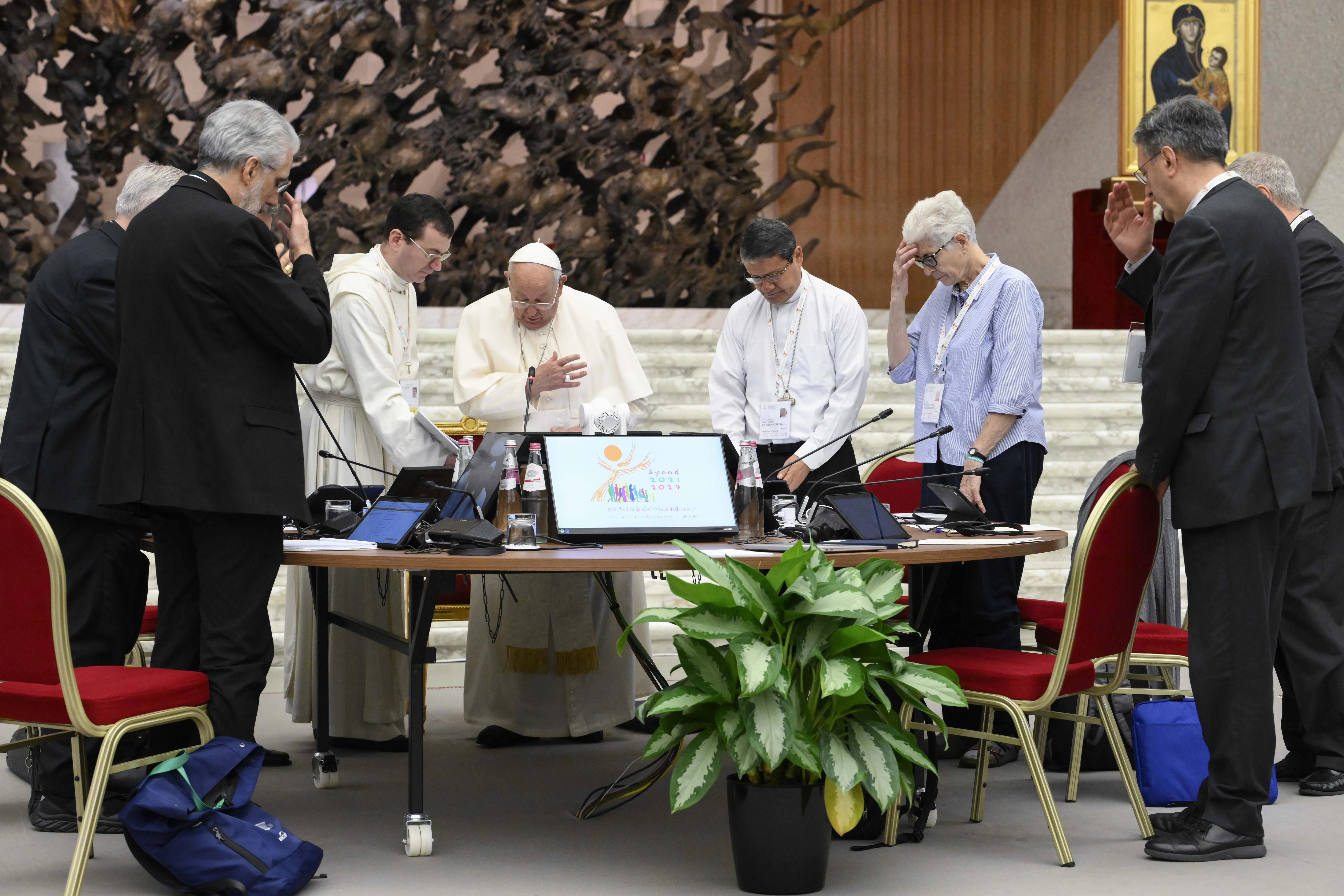 Pope Francis prays with members of the Synod on Synodality during one of its meetings in the Vatican's Paul VI Hall on the morning of Oct. 12, 2024.?w=200&h=150