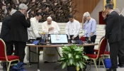 Pope Francis prays with members of the Synod on Synodality during one of its meetings in the Vatican's Paul VI Hall on the morning of Oct. 12, 2024.