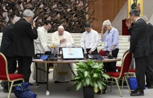 Pope Francis prays with members of the Synod on Synodality during one of its meetings in the Vatican's Paul VI Hall on the morning of Oct. 12, 2024. Credit: Vatican Media