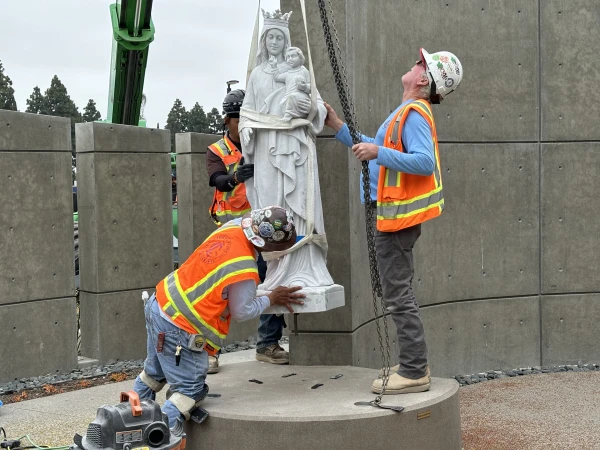 Crews carefully lower a 1,325-pound Our Lady Queen of Heaven statue made of Italian marble into place for Christ Cathedral’s Marian Gardens on June 11, 2024. The Marian Gardens, which opened in May 2024, are a walk-through experience that provides peaceful prayer, reflection and education about the life of the Virgin Mary and Jesus. Credit: Bradley Zint / Diocese of Orange