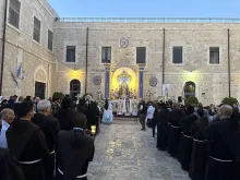 Pilgrims attend Mass ahead of a Marian procession on May 31, 2024, near the Church of the Holy Sepulcher in the Old City of Jerusalem to ask Our Lady of Palestine to intercede for peace in war-torn Gaza.