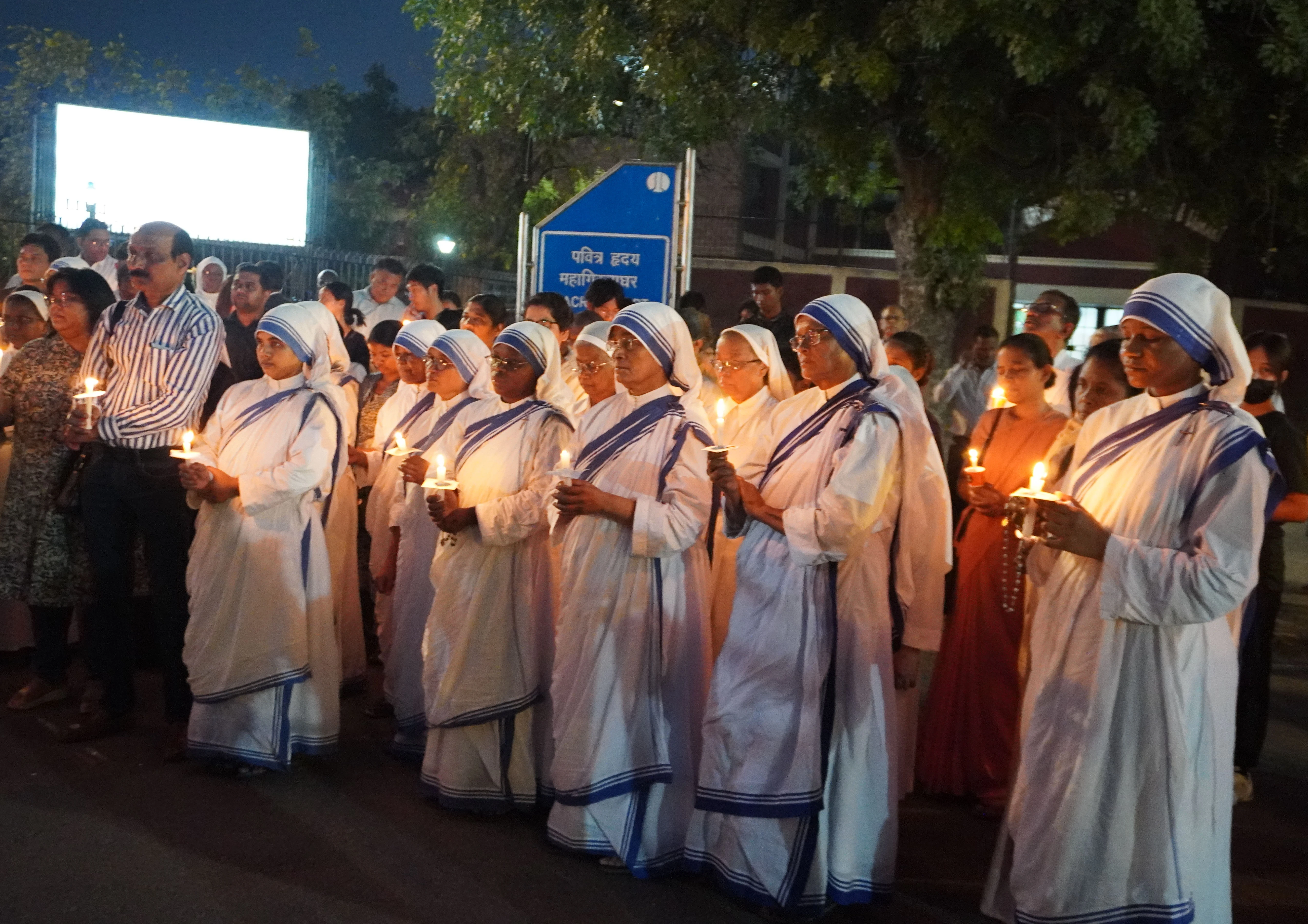 Nuns from the Missionaries of Charity hold candles in recognition of the May 3 annivesary of ethnic violence in Manipur, India.?w=200&h=150