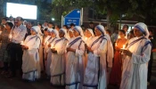 Nuns from the Missionaries of Charity hold candles in recognition of the May 3 annivesary of ethnic violence in Manipur, India.