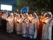 Nuns from the Missionaries of Charity hold candles in recognition of the May 3 annivesary of ethnic violence in Manipur, India.