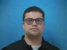 Father Juan Carlos Garcia-Mendoza is being held in jail in Williamson County, Tennessee, on $2 million bond, the police said. He had previously served at St. Philip Catholic Church in the town of Franklin.
