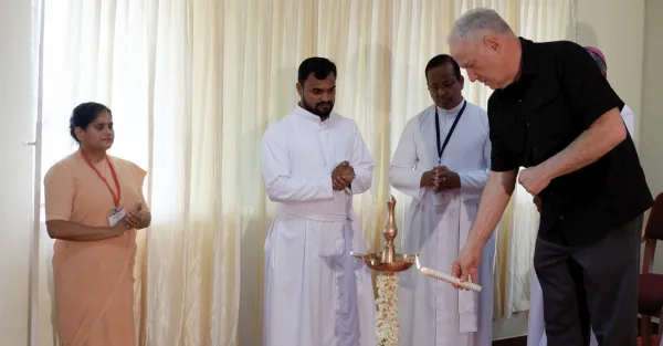 Deacon Ed Shoener, president and co-founder of the Catholic Association of Mental Health Ministers (CMHM), lights a candle for the inaugural ceremony of India’s first CMHM conference April 5–6, 2024. Credit: Photo courtesy of CMHM