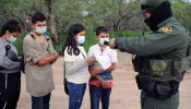 A Border Patrol agent processes a group of unaccompanied Central American minors who crossed the Rio Grande River on May 26, 2021.