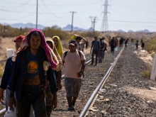 Migrants walk alongside the railroad tracks after dismounting from the “La Bestia” train, which they rode through Mexico to reach the Mexico-U.S. border near Chihuahua, Mexico, on Sept. 27, 2025.