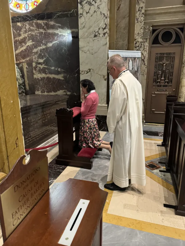 Gianna Emanuela Molla prays in front of the tomb of Venerable Nelson Baker, who is in the canonization process, at the Our Lady of Victory National Shrine and Basilica. Credit: Cheryl Calire