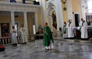 Archbishop Roberto Gonzalez prays with other priests during Sunday Mass in the San Juan Cathedral in San Juan, Puerto Rico, on Oct. 1, 2017. Credit: Ricardo Arduengo/AFP via Getty