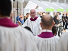 Former Sistine Chapel choir director Monsignor Massimo Palombella leads the choir during a performance on May 9, 2018, in New York City.