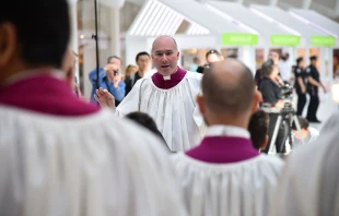 Former Sistine Chapel choir director Monsignor Massimo Palombella leads the choir during a performance on May 9, 2018, in New York City. Credit: Theo Wargo/Getty Images for AEG