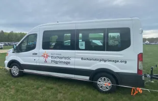 Small white vans dubbed "monstrance mobiles" are being used for the National Eucharistic Pilgrimage. They are just big enough for some of the "perpetual pilgrims" and a pedestal upon which Christ in the monstrance can be placed. Credit: Jonathan Liedl/CNA