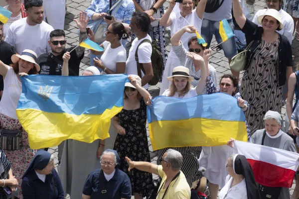 At his Angelus address June 9, Pope Francis asked people to pray for the people who are suffering in Myanmar and in Ukraine, giving a special shoutout to some Ukrainians who were in the crowd waving flags. Credit: Vatican Media