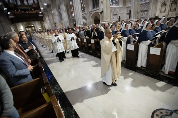 Clergy process into St. Patrick Cathedral in New York City with the Eucharist ahead of a Mass before a Eucharistic procession on Oct. 15, 2024. Credit: Jeffrey Bruno