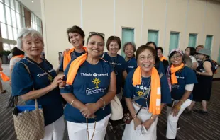 Big smiles from a group from the Diocese of Sacramento, California, as they wait in the long line to complete their registration for the congress in the Indiana Convention Center on July 15, 2024. Credit: Jeffrey Bruno/EWTN