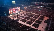 More than 50,000 kneel in adoration of the Eucharist at the National Eucharistic Congress at Lucas Oil Stadium in Indianapolis on July 18, 2024.