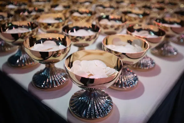 Ciboria filled with hosts await the start of Mass at the National Eucharistic Congress at Lucas Oil Stadium in Indianapolis on July 18, 2024. Credit: Jeffrey Bruno