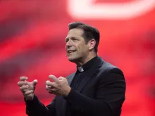 Father Mike Schmitz speaks at the revival session of the National Eucharistic Congress at Lucas Oil Stadium in Indianapolis on July 18, 2024.