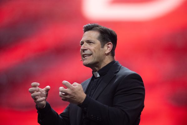 Father Mike Schmitz speaks at the revival session of the National Eucharistic Congress at Lucas Oil Stadium in Indianapolis on July 18, 2024. Credit: Jeffrey Bruno