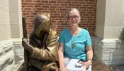 Christina Wheatley, a cancer survivor, in front of St. John the Evangelist Catholic Church in Indianapolis, where a welcome Mass was held July 16, 2024, to kick off the National Eucharistic Congress.