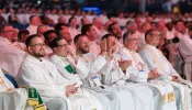 Priests respond to a talk at the National Eucharistic Congress in Indianapolis on July 18, 2024.