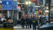 FBI investigators arrive at the scene where a pickup truck crashed into a work lift after allegedly driving into a crowd of New Year’s revelers in the French Quarter of New Orleans on Jan. 1, 2025.