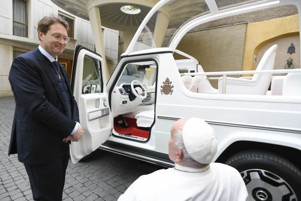 Pope Francis is shown the new popemobile, an electric Mercedes, on Dec. 4, 2024, at the Vatican. Credit: Vatican Media