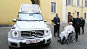 Pope Francis is shown the new popemobile, an electric Mercedes, on Dec. 4, 2024, at the Vatican.