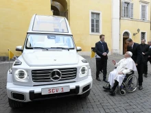 Pope Francis is shown the new popemobile, an electric Mercedes, on Dec. 4, 2024, at the Vatican.