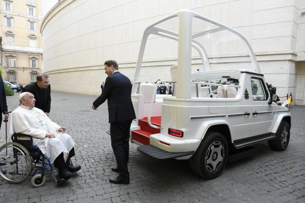 Pope Francis is shown the new popemobile, an electric Mercedes, on Dec. 4, 2024, at the Vatican. Credit: Vatican Media