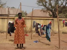 A Christian woman stands next to a clothesline while taking refuge in an internally displaced persons (IDP) camp at the Pilot Primary School after their houses were burnt as a result of religious strife in Mangu on Feb. 2, 2024, following weeks of intercommunal violence and unrest in the Plateau State.