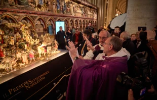 Archpriest of Notre-Dame de Paris Cathedral Monsignor Olivier Ribadeau Dumas blesses a Nativity scene in the recently reopened cathedral on Dec. 20, 2024, in Paris. Credit: Kiran Ridley/Getty Images